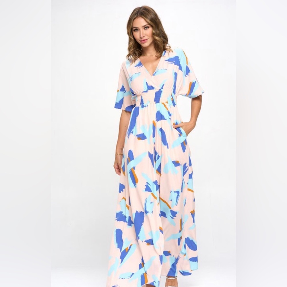 Women’s multi color wide leg Boho Jumpsuit with front pockets. S, M, L